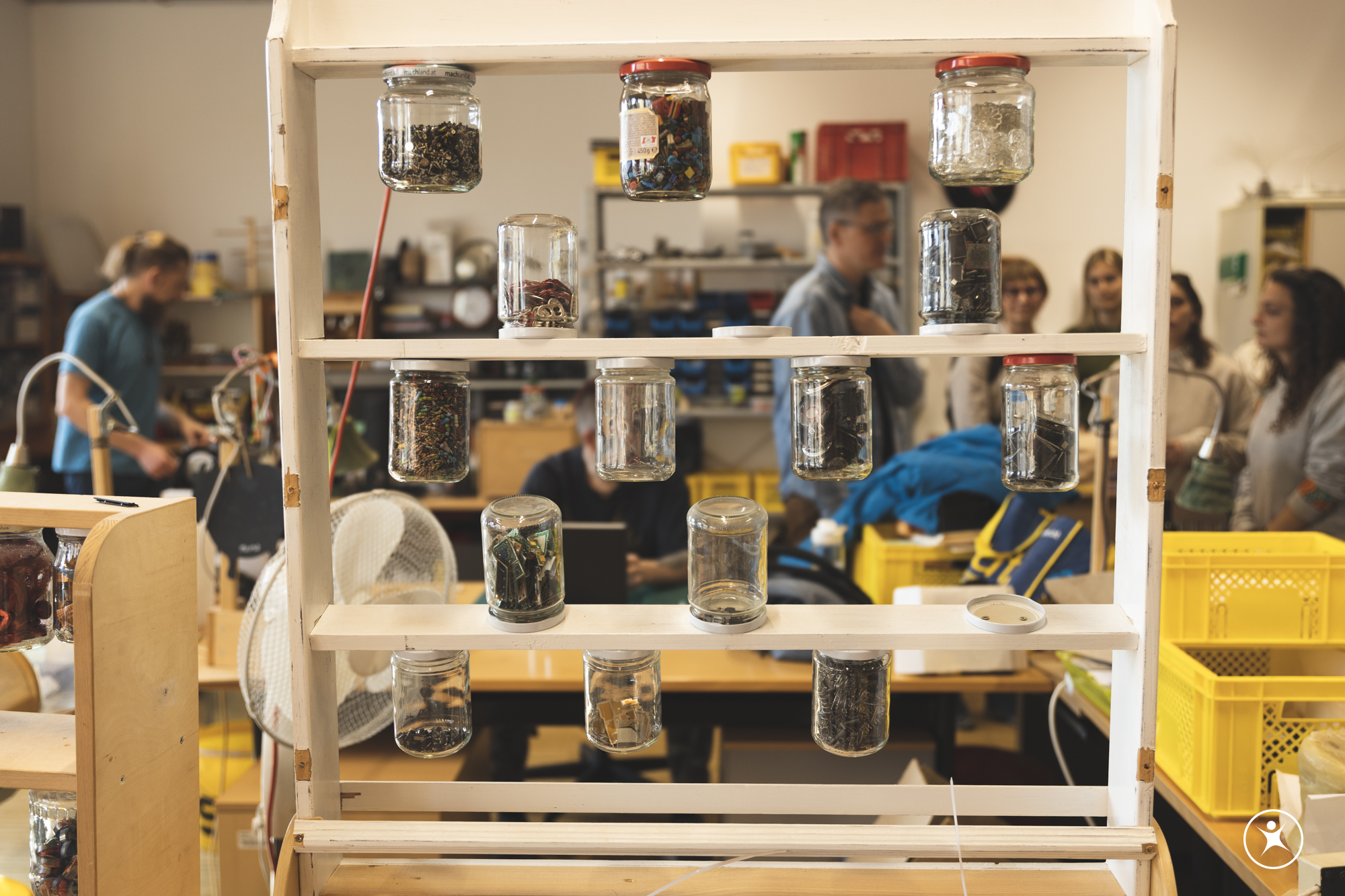 Storage rack with sorted components in a repair workshop